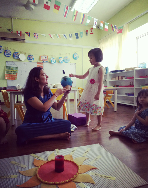 Ms. Milan Daryanani working with a student using Montessori materials