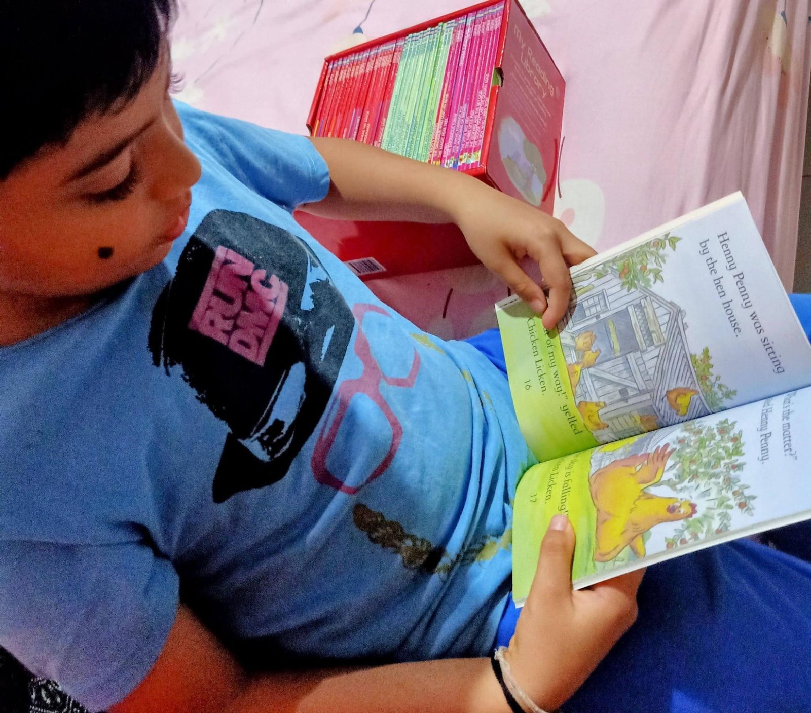 Lishaan reading a storybook with confidence